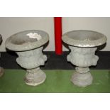 A pair of 20th century reconstituted stone garden urns