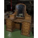 A high quality Victorian burr oak pedestal dressing table with ormolu mounted candle holders