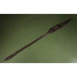 A carved African spear, 64" long