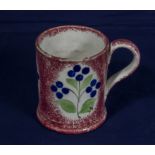 A Staffordshire pink spongeware decorated mug circa 1800's. 8cm tall