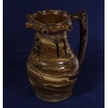 A Staffordshire agate ware puzzle jug with pierced decoration, 18th/19th century 22cm tall