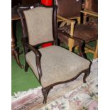An upholstered open armed chair