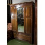 A Victorian single mirrored door wardrobe