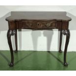 An early George III walnut, adapted side table on carved cabriole legs