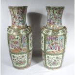 A large pair of Chinese Qing period Canton famille rose vases, 61cm tall