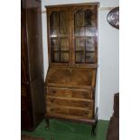 A mahogany bureau bookcase