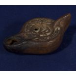 A Roman period terracotta oil lamp 'PX' decorated to the bowl, 7.5cm long and 4cm wide