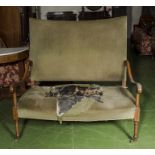 An Edwardian high backed couch in need of restoration