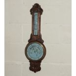 An Edwardian oak aneroid barometer
