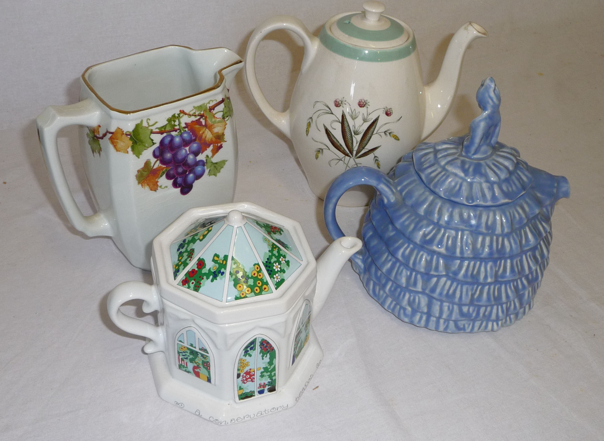 Three teapots and a jug