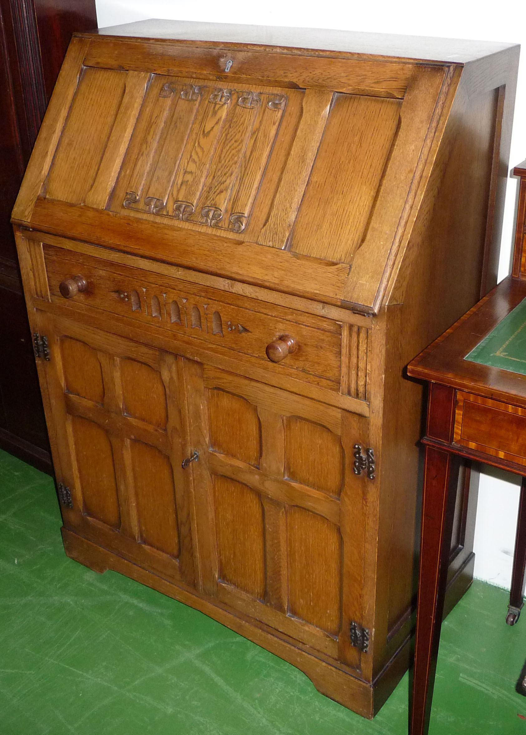 An Arts and Crafts style oak bureau