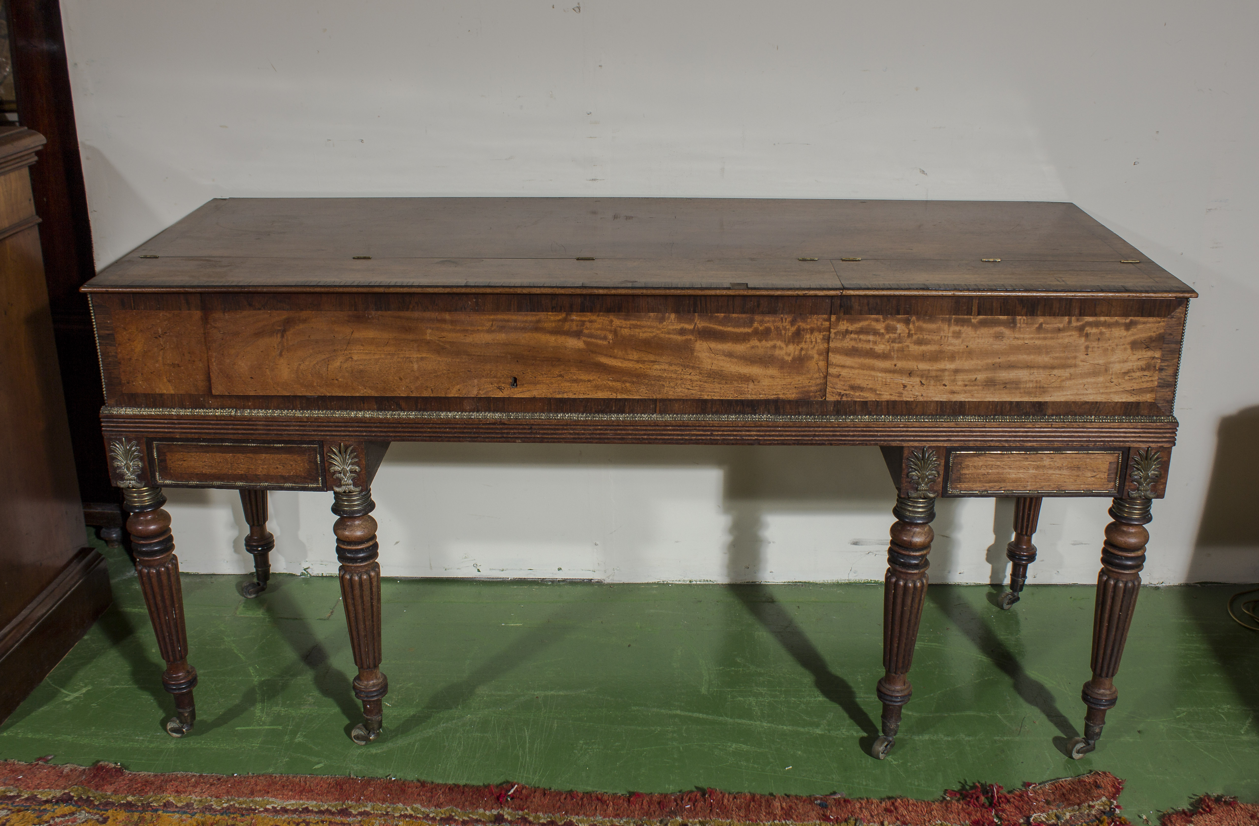 A Regency mahogany spinette case converted to a desk