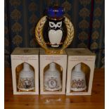 Three commemorative Bell's whisky bottles and one other, unopened