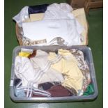 Two boxes of linen and fabric