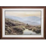 A framed print of a Scottish Highland scene