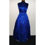 A vintage blue brocade gown and wired underskirt