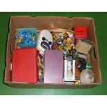 A box of assorted items including vintage marbles