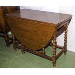 An oak drop leaf table with barley twist legs