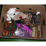 A box containing soft toys and other items