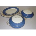 Two casserole dishes and four serving plates