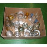 A box containing glass storage jars and others