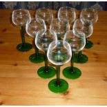 Ten green stemmed wine glasses