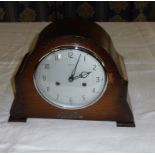 An oak mantle clock