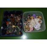 Two boxes containing plastic toys and dolls