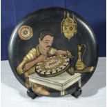Cairo Ware 1920/30's dish depicting a craftsman working with brass and silver inlay, 29cm diameter