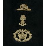 Three cap badges