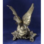 A brass figure of an eagle