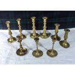 Nine brass candlesticks