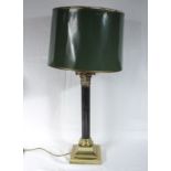 A brass Corinthian column table lamp and shade