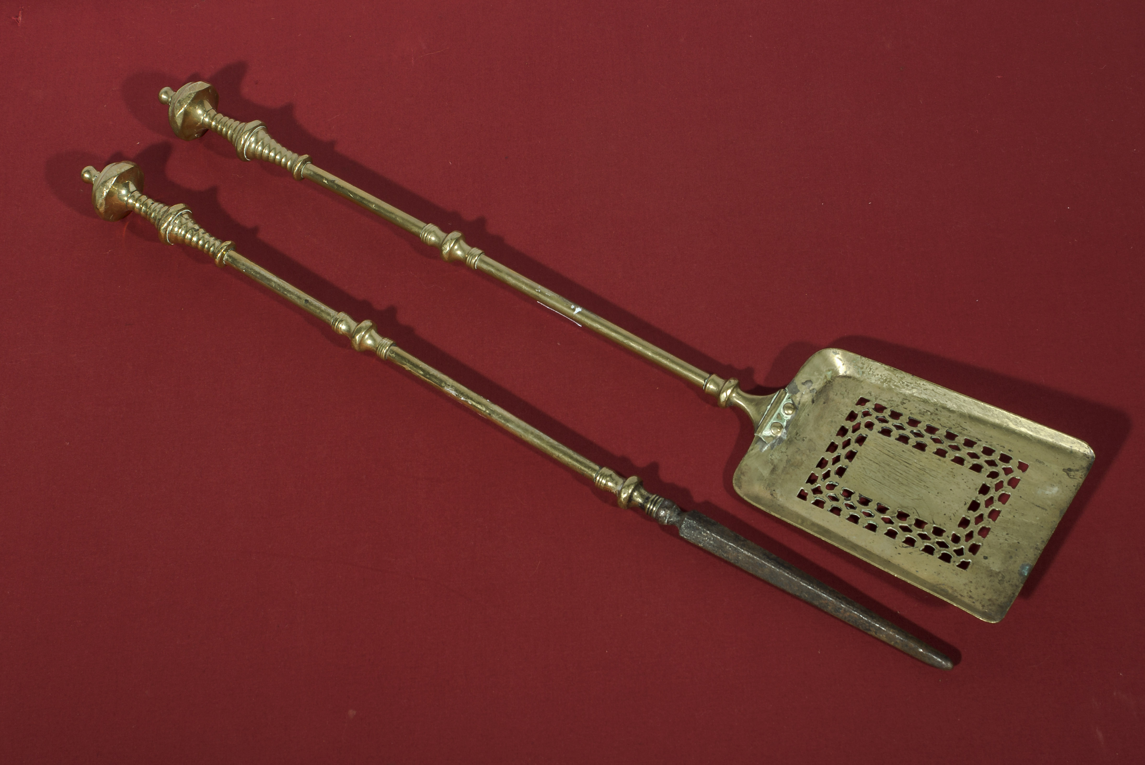 A Regency brass poker and fireside shovel