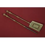 A Regency brass poker and fireside shovel