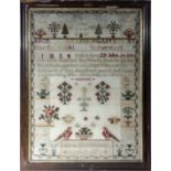 A framed sampler by Mary Martindale dated 1872, 70cm x 56cm