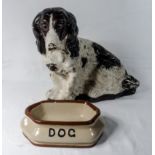 A vintage advertising dog together with a dog bowl