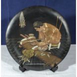 Cairo Ware 1920/30's dish depicting a craftsman turning and polishing amber for beads, 29cm