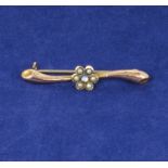 A 9ct gold bar brooch set with seed pearls and an opal