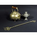 A brass kettle with amber glass handle, a mini samovar and a brass toasting fork