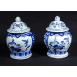 A pair of oriental lidded jars