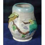 A Clarice Cliff vase decorated with budgerigars