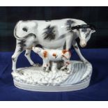 A Staffordshire figure group of a cow and calf