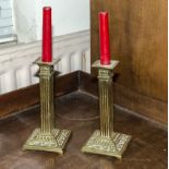 A pair of brass candle sticks