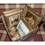 A box containing framed pictures