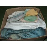 A box containing eiderdowns and bed covers