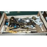 A box containing cutlery and kitchen ware