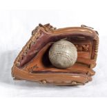 A baseball catchers mitt and ball