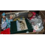 A box containing Thunderbird figures with other toys and games