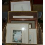 A box containing framed prints and watercolours